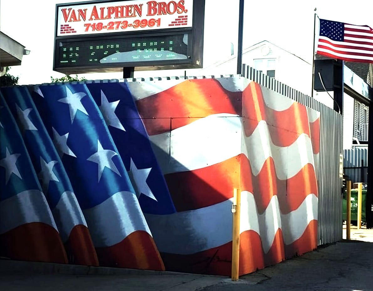 Van Alphen Bros. sign above a fence painted as an American flag